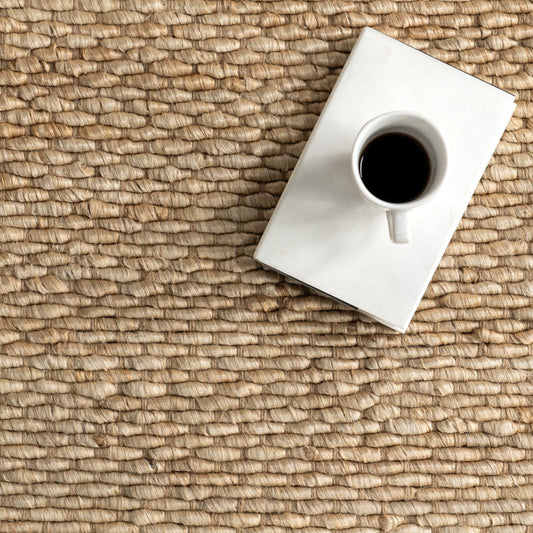 " Premium Natural Beige Jute Rug"  reflecting its material and color.