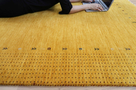 Elegant Hand-Knotted Gabbeh Rug - Warm Amber Hue with Intricate Borders