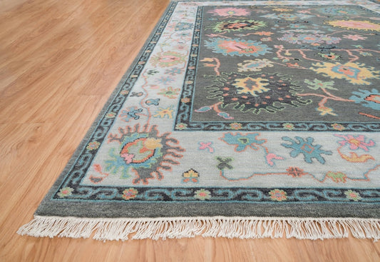 Midnight Garden | Handwoven Dark Grey & Blue Oushak Rug with Pink & Green Accents | Wool, Bedroom