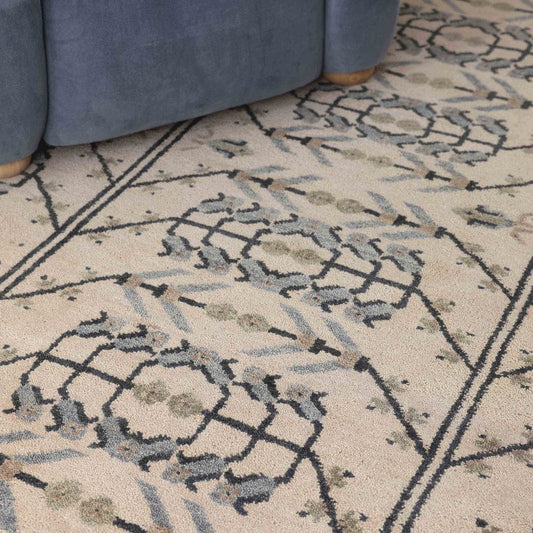 Astrid Hand-Knotted Wool Rug with Repeating Tribal Motifs in Ivory & Blue Tones