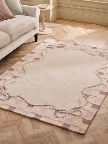 Classic Handmade Wool Area Rug with Feminine Bow Detailing and Timeless Neutral Palette